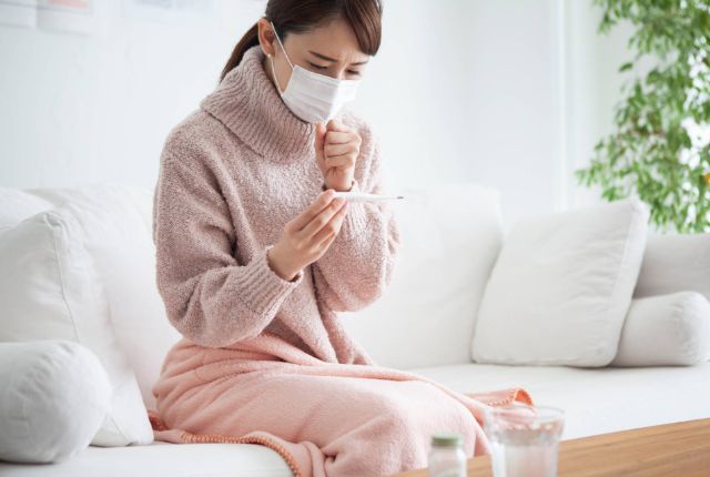 体調不良の女性
